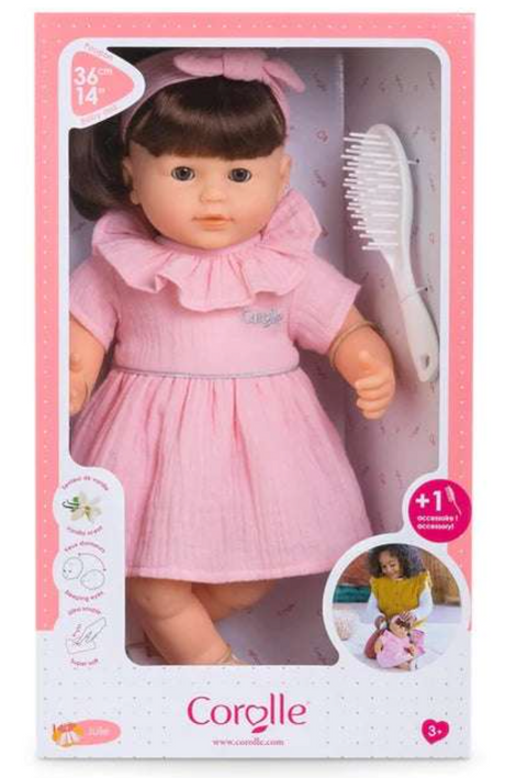 Mon Grand Poupon Julie doll with long brown hair, pink dress, white brush, and soft body for cuddling and styling.
