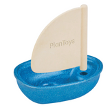 Sail Boat by PlanToys with blue hull and cream sail, designed for water play from bathtubs to ponds.
