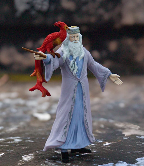 HP Dumbledore & Fawkes figure with Dumbledore holding wand and phoenix Fawkes perched on his arm in detailed robes.
