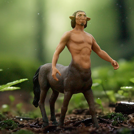 HP Firenze centaur figure with brown fur, black hooves, and strong arms standing in a forest setting.