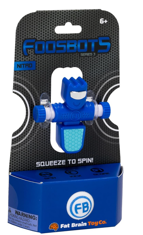 Foosbots Single toy in blue with squeeze-to-spin arms, in branded Fat Brain Toy Co. packaging, for ages 6 and up.