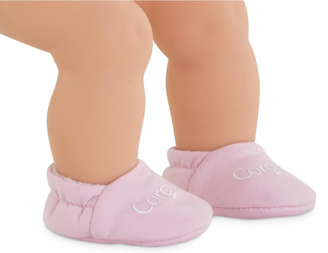 12in Pink Slippers on baby doll feet, soft pink fabric slippers for doll play and warmth.