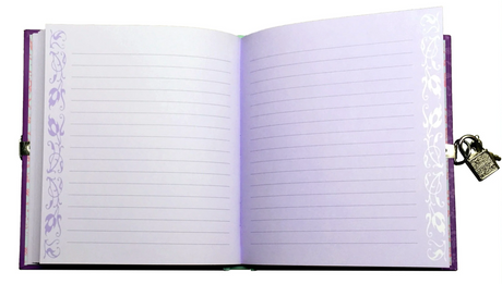 Unicorn Diary open to lined pages with decorative purple borders and a silver lock on the hardcover diary.