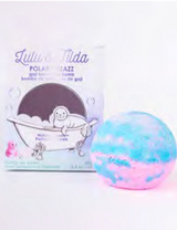 Bath Bomb | Polar Pizzazz with blue and pink swirls beside playful packaging featuring a seal in a bathtub.