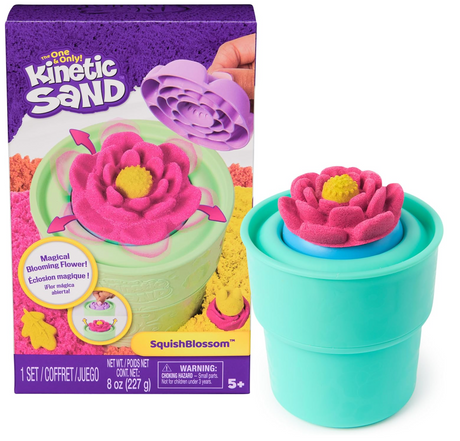 Kinetic Sand SquishBlossom kit with pink flower mold stamped in green flowerpot for creative sensory play.