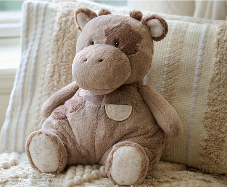 Oh So Snuggly Cow plush toy in light brown with quilted ears and feet, perfect for all ages and machine washable.