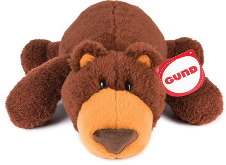 Teddy Bear Tush plush toy in a relaxed snoozing pose with chestnut-brown and amber soft fur, 15 inches long.