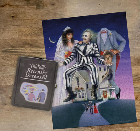 500pc Beetlejuice Puzzle completed with characters and decorative tin resembling the Handbook for the Recently Deceased.