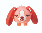 Perk Ups! small squeezable dog toy with floppy red ears and a happy closed-eye expression.