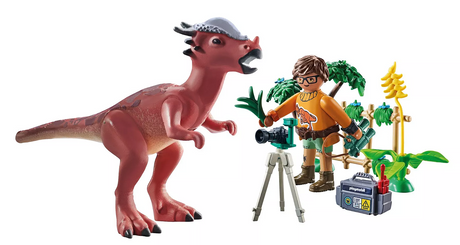 Dinos | Stygimoloch Observation with a researcher capturing the red Stygimoloch dinosaur amidst plants and equipment.