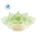 Roly Poly Dino baby toy bobbing up and down with bell sound, perfect for sensory play and cause-effect learning.