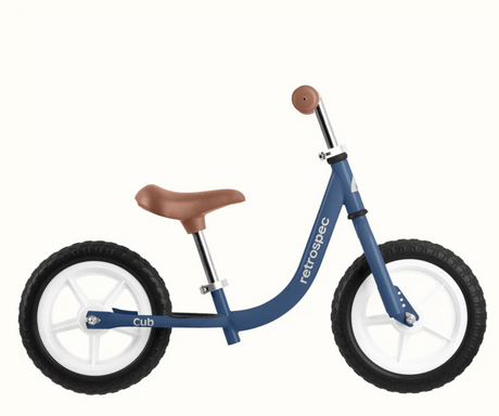 Cub Balance Bike | Navy with lightweight frame, adjustable seat and handlebars, and airless tires for safe balancing.