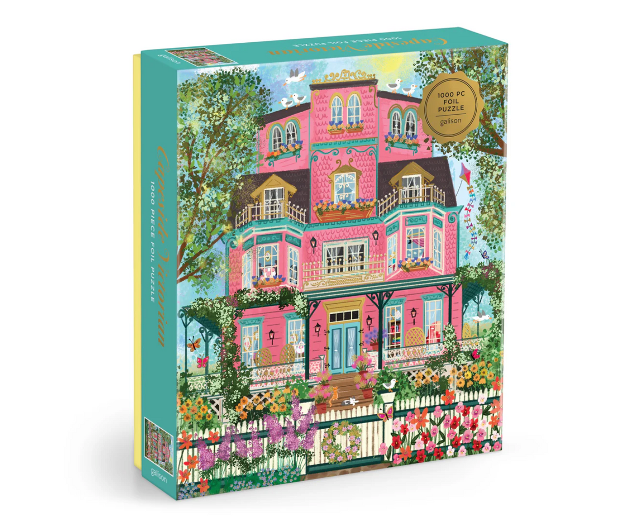 1000pc Capeside Victorian House Puzzle featuring a charming pink Victorian house surrounded by vibrant gardens in springtime.