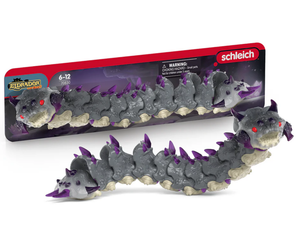 Eldrador Creatures Shadow Worm toy with a long body, spiky purple crystals, fiery red eyes, and sharp teeth for ages 3 and up.