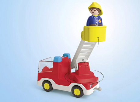 Junior | Ladder Unit Fire Truck with a firefighter figure in a movable basket on a swiveling ladder against a blue background.