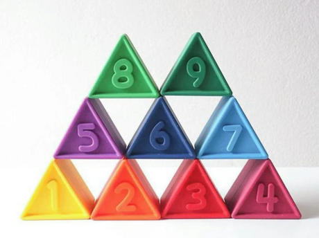 Triblox | Rainbow pastel-colored triangular blocks numbered 1 to 9, designed for sensory and cognitive play.