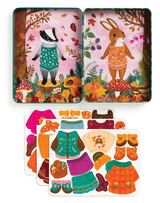 Magnetic Dress Up Folklore Forest with woodland animals and colorful fall-themed magnetic clothing pieces for creative play.