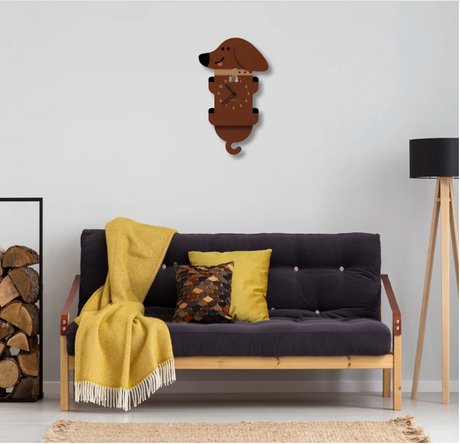 Wood Pendulum Clock | Wiener Dog hanging on wall above couch with yellow throw and pillows in living room.