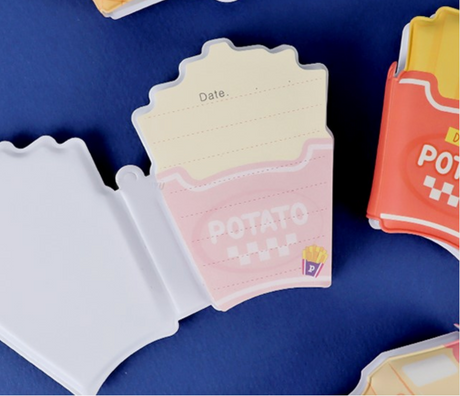 Notebook with a potato chip design, featuring soft cover and lined pages for notes or a snack diary.