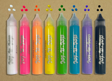 Eight vibrant Dot-A-Lot dimensional craft paint bottles with matching colorful dots on a brown background