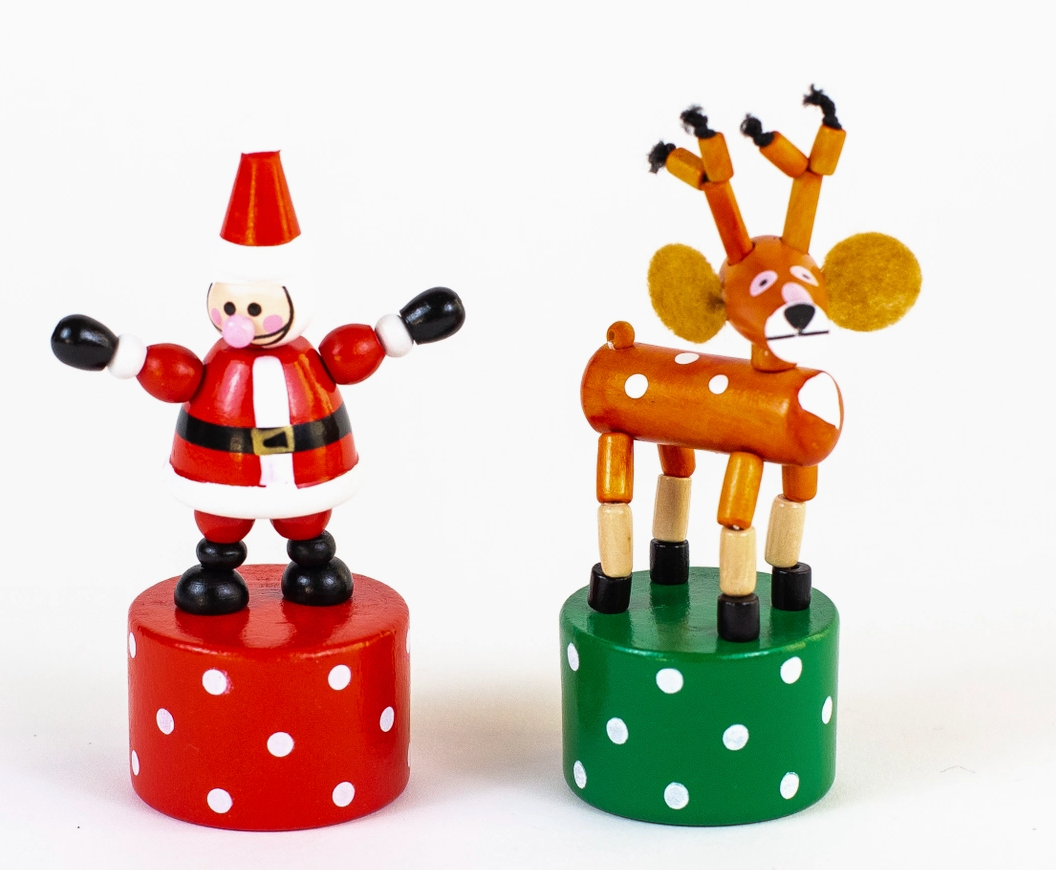 Wooden Santa and reindeer push puppets on red and green bases with white polka dots for festive fun