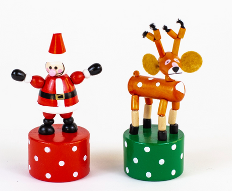 Wooden Santa and reindeer push puppets on red and green bases with white polka dots for festive fun