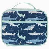 Junior lunchbox with fun shark pattern, insulated and waterproof with extra storage pockets and a light blue trim.