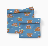 Reusable Snack and Sammy pouches in blue with playful turtle illustrations for eco-friendly lunch packing.