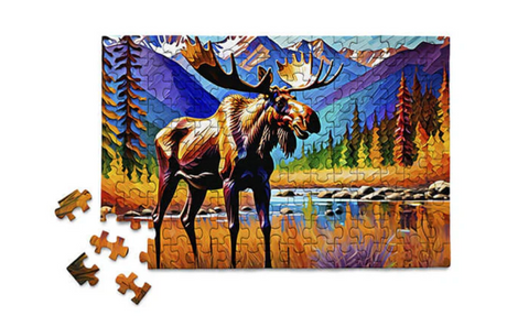 Colorful moose puzzle by a stream with vibrant trees and mountains in a playful nature scene with 150 pieces.
