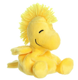 Soft and cheerful yellow plush toy of Woodstock from Peanuts with a tufted head and a smiling face sitting down