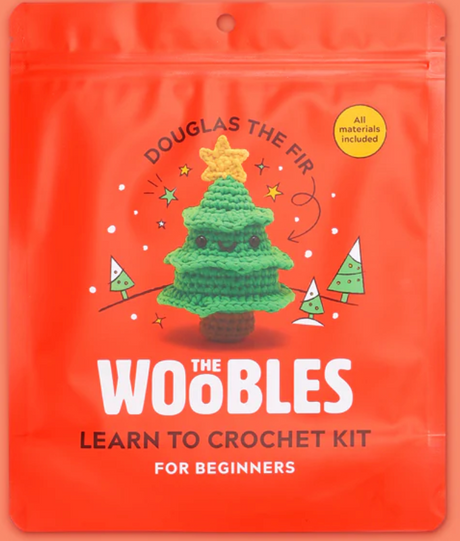 Bright orange package featuring Douglas the Fir crochet tree with star, eyes, and smiling face for beginner kit
