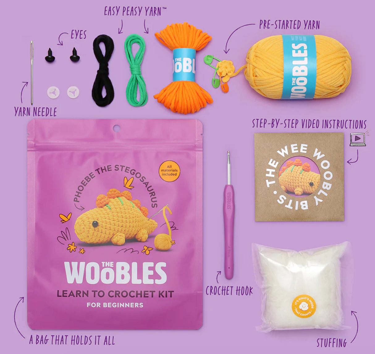 Complete crochet kit for beginners to create Phoebe the Stegosaurus with yarn, hook, stuffing, eyes, and instructions