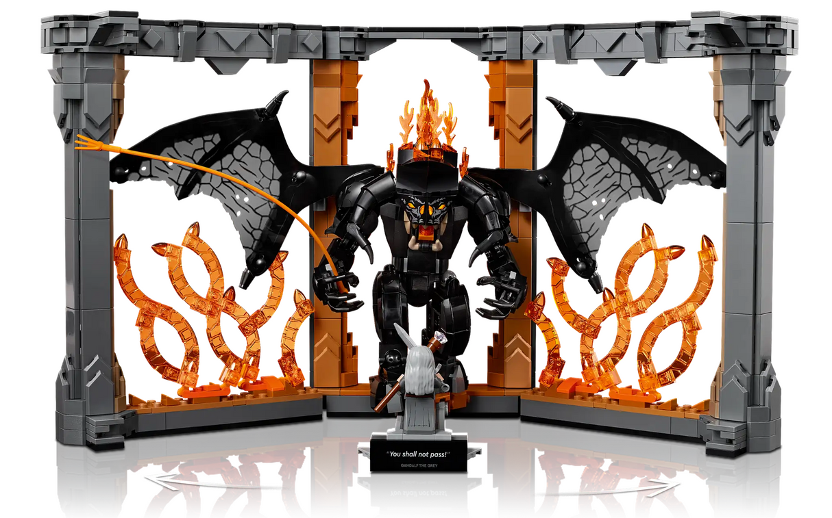 LEGO scene of Gandalf facing the Balrog with fiery wings and flames on a detailed Middle-earth bridge display.