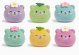 Six colorful round plush mochi bears with flower and leaf decorations, soft textured squish toys for sensory play.