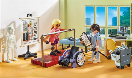 Toy orthopedic clinic scene with doctor, patient on treadmill, wheelchair, skeleton, and medical equipment in bright room.