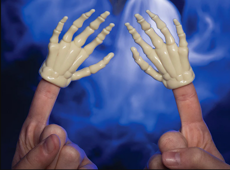 Two glow in the dark skeleton finger hands worn on index fingers against a dark smoky background