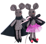Two fabric mice dressed in skeleton suits with capes and a pink tutu, smiling softly against a white background.