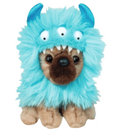 Plush toy dog wearing a fluffy blue monster hood with three eyes and playful horns sitting upright