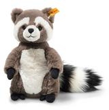 Soft plush raccoon toy with brown and white fur, button eyes, and a fluffy striped tail standing upright.