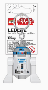 Lego Star Wars R2D2 key light with LED, shaped like a miniature droid, includes key ring and battery for ages 6 and up.