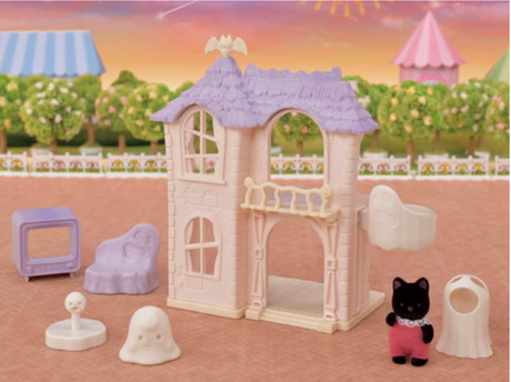 Spooky Surprise House playset with ghost figure, black cat, elevator, furniture, and ghost costume pieces for kids.