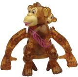 Brown translucent wind-up chimpanzee toy walking sideways with a baby chimp on its back playing peek-a-boo