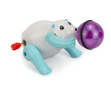Wind-up polar bear toy with blue paws spinning a purple ball, designed for fun and interactive play.