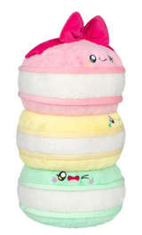 Stack of three colorful plush macarons with cute faces and a bow on the top macaron made of soft polyester fiber
