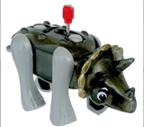 Wind-up toy dinosaur with a black body, gray legs, red knob, nodding head, and swinging tail for kids ages 3 and up