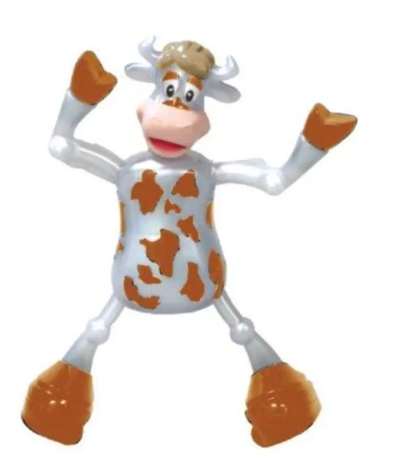 White and brown spotted dancing cow toy with raised arms and legs wearing orange gloves and boots