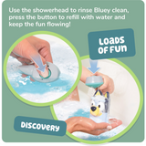 Child pressing button on Bluey showerhead toy to refill with water and rinse Bluey clean during bath play