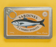 Vintage sardine tin-style notebook with textured metal cover and playful olive oil design on yellow background