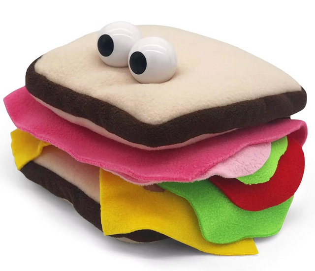 Mini plush sandwich finger puppet with googly eyes featuring layers of bread, lettuce, tomato, and cheese for playtime fun