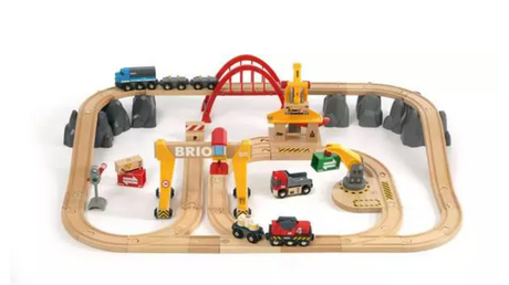 Battery-powered cargo train set with wooden tracks, cranes, and various freight cars for imaginative play